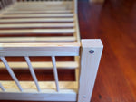 Durable toddler bed frame crafted from solid pine wood for growing children
