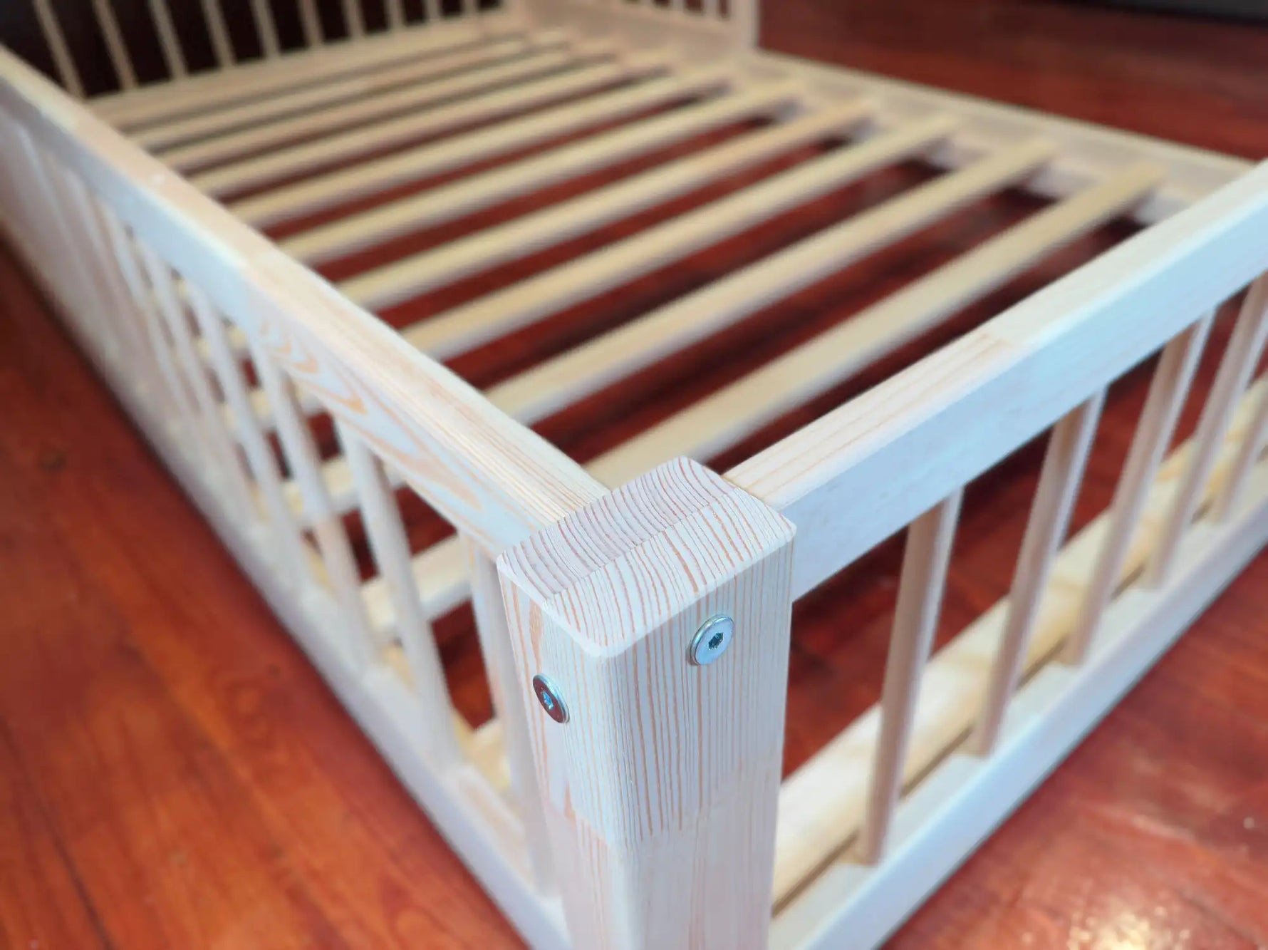 Montessori toddler floor bed frame in solid pine wood with low-profile design