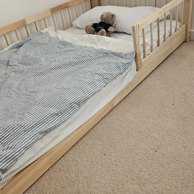 Snuglee premium pine wood bed showcased in a real family bedroom setup