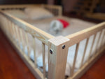 Toddler bed frame made from solid pine wood designed for safe sleep and independence
